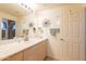Bright bathroom vanity with modern fixtures, a large mirror, and plenty of storage space at 7401 W Arrowhead Clubhouse Dr # 2003, Glendale, AZ 85308