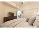 This bedroom has carpeted floors and a large dresser with a TV on top at 7401 W Arrowhead Clubhouse Dr # 2003, Glendale, AZ 85308