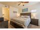 Spacious bedroom with a ceiling fan, neutral walls, and decorative touches at 7401 W Arrowhead Clubhouse Dr # 2003, Glendale, AZ 85308