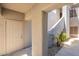 Private courtyard featuring light stucco walls,desert landscaping, and a doorway into the house offers privacy at 7401 W Arrowhead Clubhouse Dr # 2003, Glendale, AZ 85308