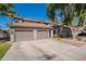 Charming residence with a convenient two-car garage, desert landscaping, and beautiful palms providing ample parking at 7401 W Arrowhead Clubhouse Dr # 2003, Glendale, AZ 85308