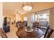 Open living space with a dining area, living room, and access to a balcony with outdoor seating at 7401 W Arrowhead Clubhouse Dr # 2003, Glendale, AZ 85308