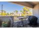 Outdoor seating area with desert landscaping and a view of the surrounding buildings at 7401 W Arrowhead Clubhouse Dr # 2003, Glendale, AZ 85308
