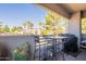 Cozy patio with a grill, a bar-height dining table, and desert landscaping at 7401 W Arrowhead Clubhouse Dr # 2003, Glendale, AZ 85308