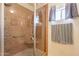 Shower room with bench seating, glass enclosure and decorative accents at 7401 W Arrowhead Clubhouse Dr # 2003, Glendale, AZ 85308