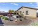 Beautiful backyard featuring a large patio area with seating and lush landscaping at 8445 N 61St Ln, Glendale, AZ 85302