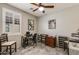 Comfortable bedroom with shuttered windows, neutral walls, and tile floors at 8445 N 61St Ln, Glendale, AZ 85302