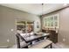 Cozy dining room with a modern chandelier, patio access, and ample natural light at 8445 N 61St Ln, Glendale, AZ 85302