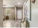 Spacious entryway with tile flooring, decorative art, and natural light from a window at 8445 N 61St Ln, Glendale, AZ 85302