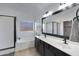 Bright bathroom featuring double sinks, tub, stand alone shower and stylish fixtures at 8544 E Ocaso Ave, Mesa, AZ 85212