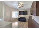 Comfortable bedroom/office with a ceiling fan, modern furniture, and built-in shelving at 8544 E Ocaso Ave, Mesa, AZ 85212