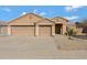 Charming single-story home featuring a well-maintained front yard, three-car garage and neutral stucco exterior at 8544 E Ocaso Ave, Mesa, AZ 85212