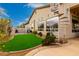 Beautiful backyard featuring artificial turf, desert landscaping, and a spiral staircase leading to the upper level at 8607 E Preserve Way, Scottsdale, AZ 85266