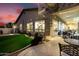 Backyard featuring lush greenery and a spiral staircase leading to a second level outdoor living space at 8607 E Preserve Way, Scottsdale, AZ 85266