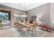Formal dining room with large window and elegant chandelier at 8607 E Preserve Way, Scottsdale, AZ 85266
