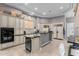 Bright kitchen with stainless steel appliances, large island, and wine fridge at 8607 E Preserve Way, Scottsdale, AZ 85266