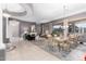 Elegant living and dining room with neutral colors, high ceilings, and large windows at 8607 E Preserve Way, Scottsdale, AZ 85266