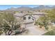 Aerial shot of home displaying desert landscaping, a tile roof, and mountain views at 10468 E Raintree Dr, Scottsdale, AZ 85255