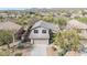 Aerial view of home showcasing desert landscaping, tile roof, and mountain views at 10468 E Raintree Dr, Scottsdale, AZ 85255