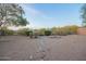 This backyard is a natural oasis with desert landscaping and scenic views at 10468 E Raintree Dr, Scottsdale, AZ 85255