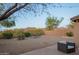 Desert landscaped backyard featuring scenic mountain views beyond the fence at 10468 E Raintree Dr, Scottsdale, AZ 85255