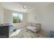 Bedroom with a crib, area rug, a large window, and natural light at 10468 E Raintree Dr, Scottsdale, AZ 85255