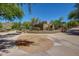 Beautiful community landscaping featuring desert plants, natural stone, and a tranquil ambiance at 10468 E Raintree Dr, Scottsdale, AZ 85255