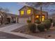Charming two-story home featuring a two-car garage and desert landscaping on a corner lot at 10468 E Raintree Dr, Scottsdale, AZ 85255