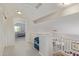 Upstairs hallway with view of the bedroom, stairs, and natural light at 10468 E Raintree Dr, Scottsdale, AZ 85255