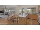 Open-concept kitchen featuring wood cabinets, stainless steel appliances, and backyard access at 10468 E Raintree Dr, Scottsdale, AZ 85255