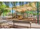 Shaded playground featuring slides, climbing structures, and swings for enjoyment at 10468 E Raintree Dr, Scottsdale, AZ 85255