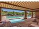 Relaxing community pool area with shade structures and comfortable seating for residents at 10468 E Raintree Dr, Scottsdale, AZ 85255