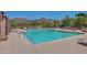 Large community pool with mountain views and ample lounging space for residents at 10468 E Raintree Dr, Scottsdale, AZ 85255