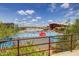 View of lap pool with racing lines, lounge chairs and large shade structures at 10468 E Raintree Dr, Scottsdale, AZ 85255