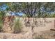 Stone sign for the McDowell Mountain Recreation Center with desert landscaping at 10468 E Raintree Dr, Scottsdale, AZ 85255