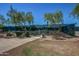 Fenced tennis courts with mature desert landscaping at 10468 E Raintree Dr, Scottsdale, AZ 85255