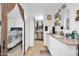 Bathroom featuring a vanity, and a walk-in closet with lots of room for clothing at 10842 W Sarabande Cir, Sun City, AZ 85351