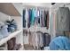 Organized walk-in closet with shelving and hanging rods, showcasing ample storage space at 10842 W Sarabande Cir, Sun City, AZ 85351