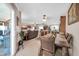 View from dining room showing an open layout to the living room and kitchen at 10842 W Sarabande Cir, Sun City, AZ 85351