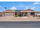 Charming home features a neutral color palette, solar panels, and well-maintained desert landscaping at 10842 W Sarabande Cir, Sun City, AZ 85351