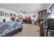 Bright main bedroom with fireplace and tile floor at 10842 W Sarabande Cir, Sun City, AZ 85351