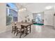 Dining area featuring a modern table set, large window, and neutral tones at 1232 W Kesler Ln, Chandler, AZ 85224