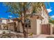 Two-story home with a landscaped front yard and a view of neighboring houses along a tree-lined street at 12887 N 93Rd Dr, Peoria, AZ 85381