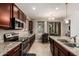 Well-equipped kitchen featuring granite countertops, stainless steel appliances, tile floors and a breakfast nook at 12887 N 93Rd Dr, Peoria, AZ 85381