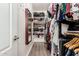 Organized walk-in closet with ample shelving and hanging space for clothes and shoes at 12887 N 93Rd Dr, Peoria, AZ 85381