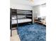 Cozy bedroom features a bunk bed, comfortable couch, and blue rug at 13219 N 46Th Pl, Phoenix, AZ 85032
