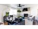 Bright living room with a gray fireplace, large sofa, and neutral-toned decor for a modern and inviting space at 13219 N 46Th Pl, Phoenix, AZ 85032