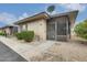 Single-story home exterior with a cozy, screened porch and low-maintenance landscaping at 13611 N 98Th Ave # D, Sun City, AZ 85351