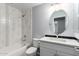 Bathroom showcasing a shower and tub combo with stylish tile work and modern vanity at 13616 N 41 Pl, Phoenix, AZ 85032
