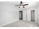 A minimalist carpeted bedroom features neutral paint and closet at 13616 N 41 Pl, Phoenix, AZ 85032